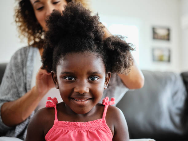 istock Mom and Daughter Doing Hair 1131428217