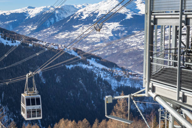Vanoise Express arriving to a station in Peisey-Vallandry/Les Arcs Les Arcs, France -January 2019: Vanoise Express arriving to a station in Peisey-Vallandry/Les Arcs. The double decker cable car connects ski resorts La Plagne and Les Arcs, capacity 200 passengers in two levels per cabin la plagne photos stock pictures, royalty-free photos & images