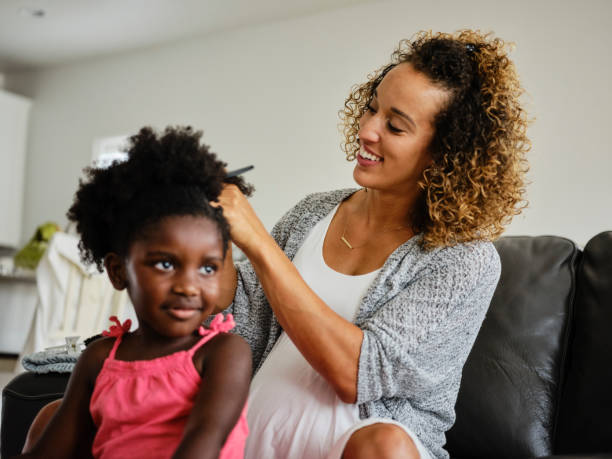 istock Mom and Daughter Doing Hair 1131428444