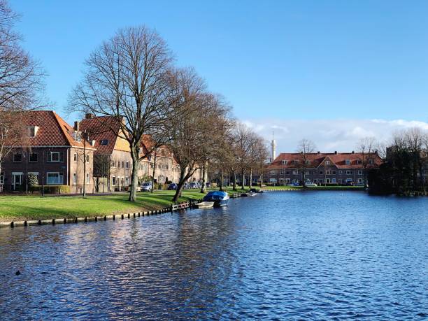 istock View Of Buildings By River Against Sky 1131428478