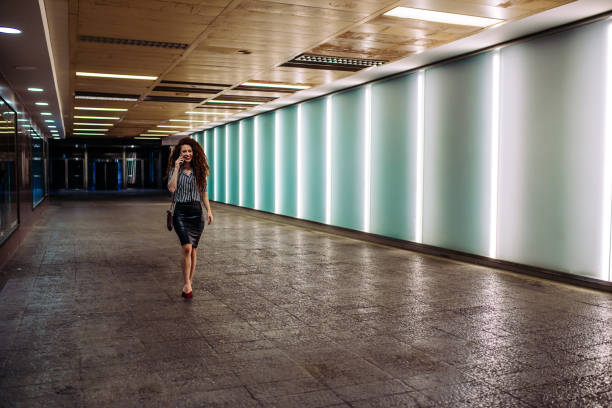 istock Young redhead business woman walking to work 1131433971