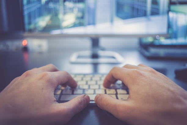 istock Workplace of a freelancer: Typing hands, screen in the blurry background 1131434471