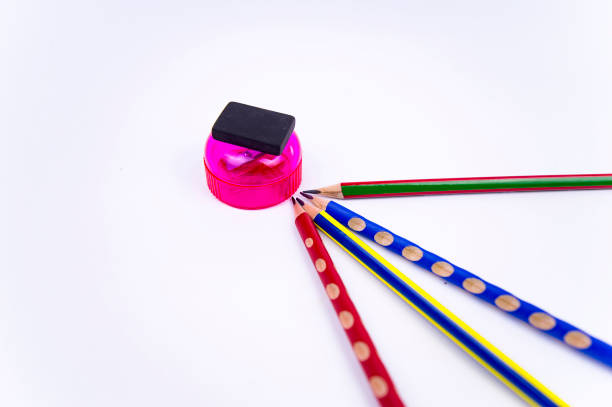 istock colored pencils with eraser and sharpener on a white background, there is free space to fill 1131434569