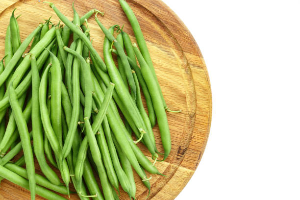 istock fresh asparagus beans isolated on white background. 1131434646
