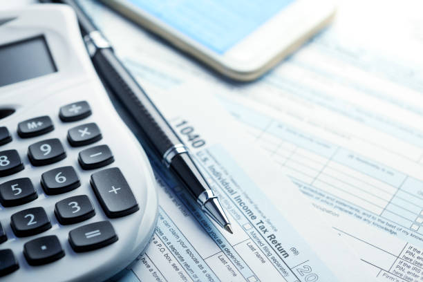 istock Calculating Income Taxes 1131434727