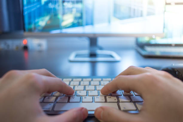 istock Workplace of a freelancer: Typing hands, screen in the blurry background 1131434854