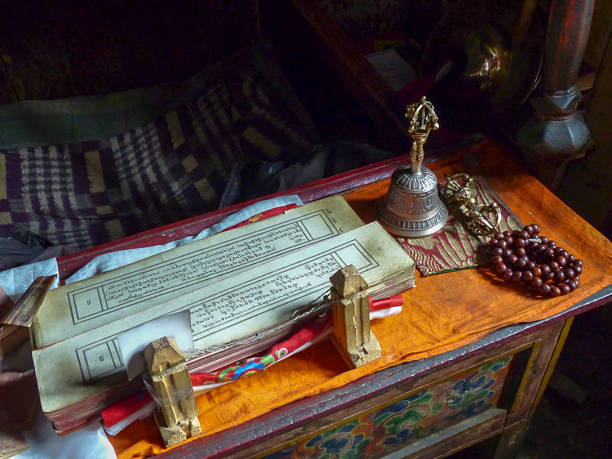 istock Decorated wooden chest laid out with Buddhist text and objects for prayer 1131436793