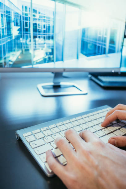 istock Workplace of a freelancer: Typing hands, screen in the blurry background 1131436865