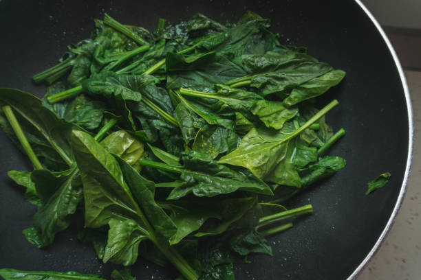 istock Spinach leaves cooked in a pot. Vegan concept 1131437970
