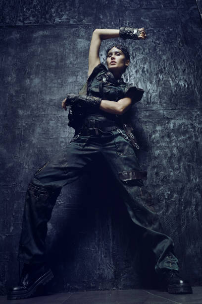 istock Young woman on dark background 1131439819