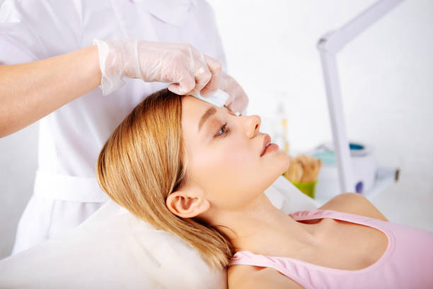 istock Depilatory specialist wearing gloves making a depilation 1131440335