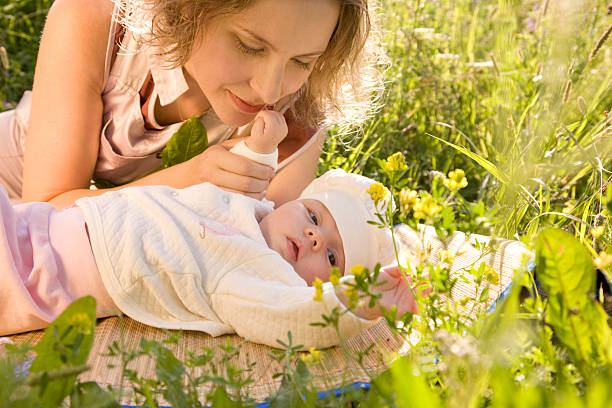 Mother and baby in the grass. stock photo