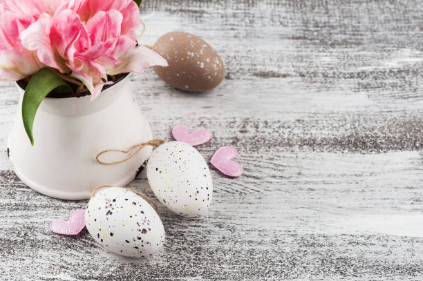 istock Fresh flowers in jug and Easter eggs 1131444626