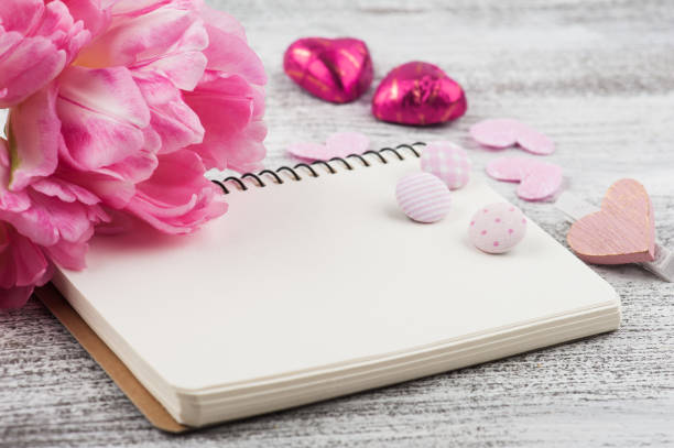 istock Fresh pink tulip flowers and notebook 1131444807