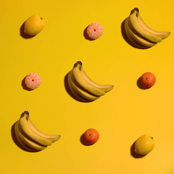 istock Pattern with banana, mandarin and lemon. Tropical abstract background. 1131447374