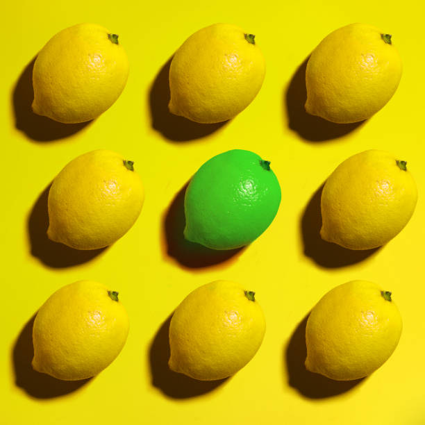 istock Yellow background. Lemon fruit. One lemon is not like all, top view, copy space 1131447380