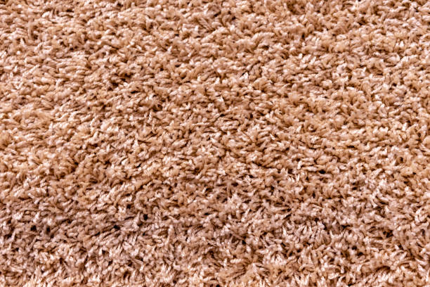 istock Texture of a beige carpet with a large nap. 1131447813