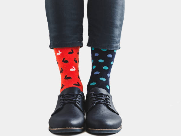 istock Office Manager in stylish shoes and bright socks 1131453104
