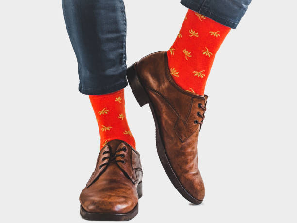 istock Office Manager in stylish shoes and bright socks 1131453118