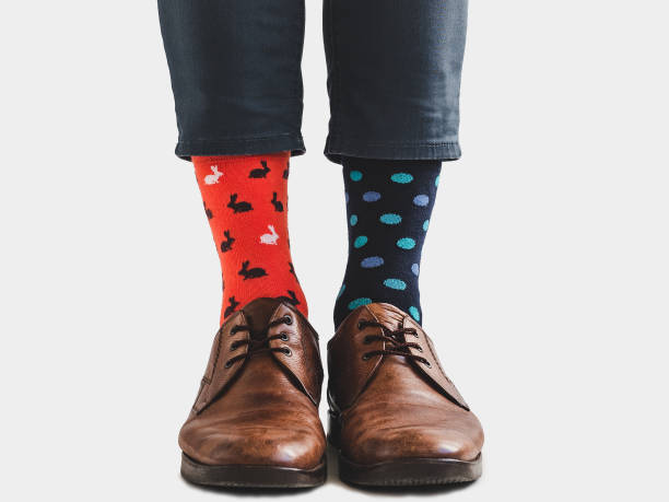 istock Office Manager in stylish shoes and bright socks 1131453207