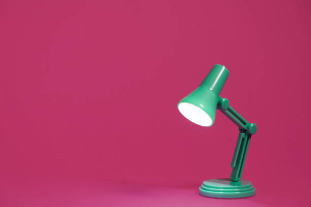 istock Retro green desk lamp on pink 1131454131