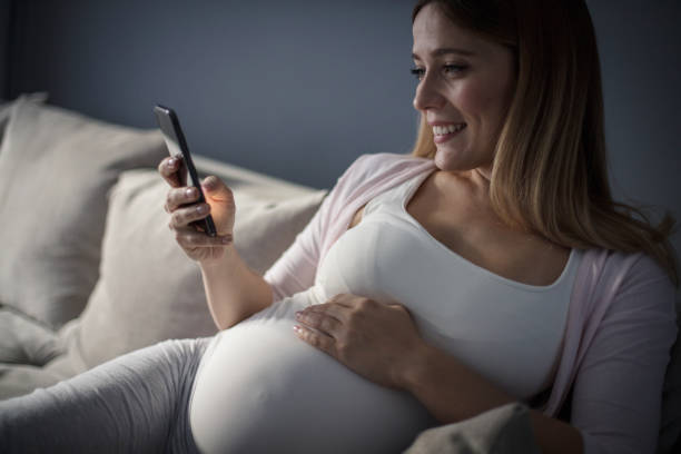 istock Letting everyone know about her new arrival on its way. 1131455235
