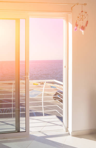 istock View of a balcony with floor to ceiling windows in sunlight 1131457645