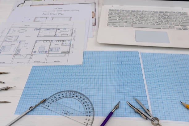 istock Paper for drafting and tools with laptop on desk 1131458003