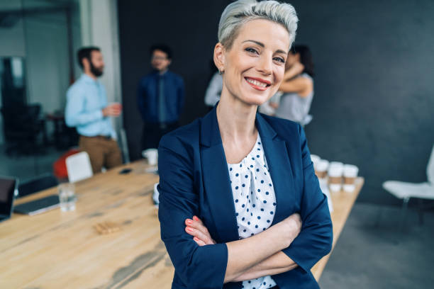 istock Business woman with his team behind 1131462478