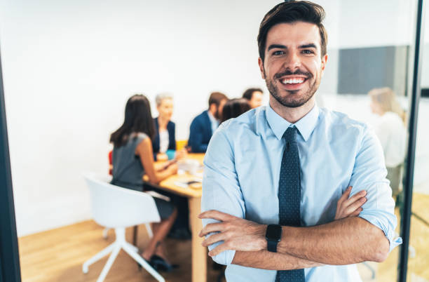 istock Businessman with his team behind 1131462482