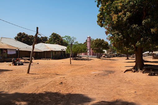 Gabu Region, Republic of Guinea-Bissau - February 7, 2018: View of the village of Mandina Mandinga in the Gabu Region with a mosque on the background, in Guinea Bissau.