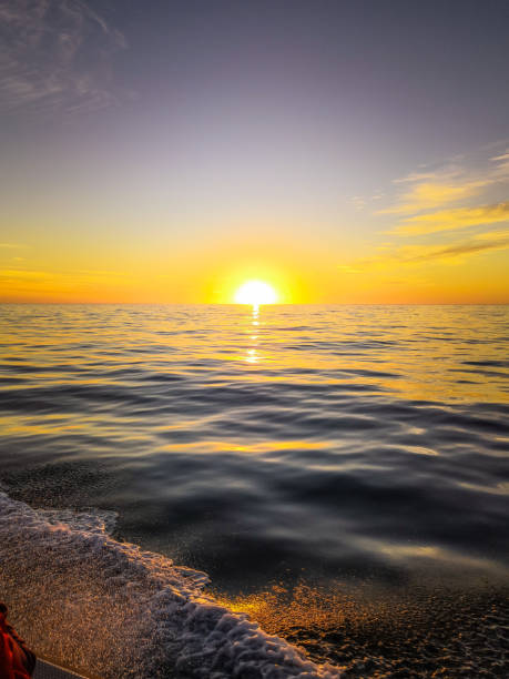 Scenic sunset or sunrise over sea surface. Natural scenery, beautiful landscape