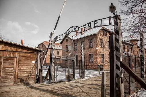 Oswiecim, Poland - March 31, 2014 : View from railway tracks onto the entrance portal of the former concentration camp Auschwitz-Birkenau