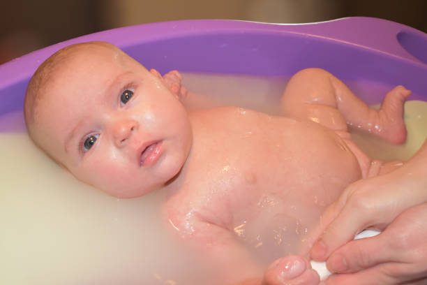 istock Baby Girl in Bath Tub Being Washed 1131470621