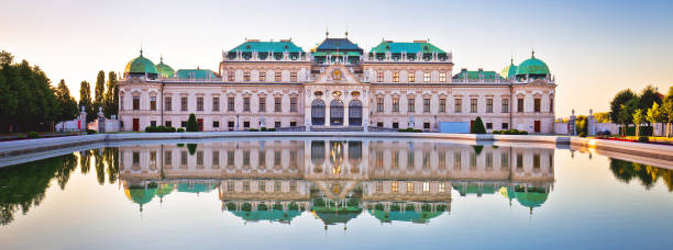 Belvedere in Vienna water reflection view at sunset Vienna, Austria, July 03 2018: Belvedere castle in Vienna water reflection view at sunset, landmark of  capital of Austria. Famous park visited by many tourists. hundertwasser haus in vienna austria stock pictures, royalty-free photos & images