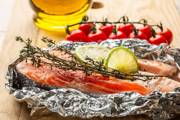 istock Unroasted red salmon with thyme and lime slices 1131473206