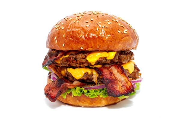 Juicy beef burger with bacon, cheese and salad. Close-up.