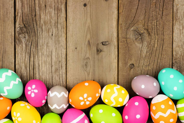 istock Colorful Easter Egg bottom border on a wood background 1131481184