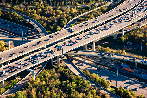 A grouping of freeways layered and curving in the downtown Houston, Texas area shot from from an altitude of about 1500 feet.