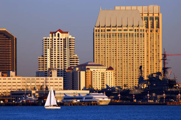 San Diego, CA, USA March 28, 2007 A lone sailboat glides along the waters of the bay at San Diego, California