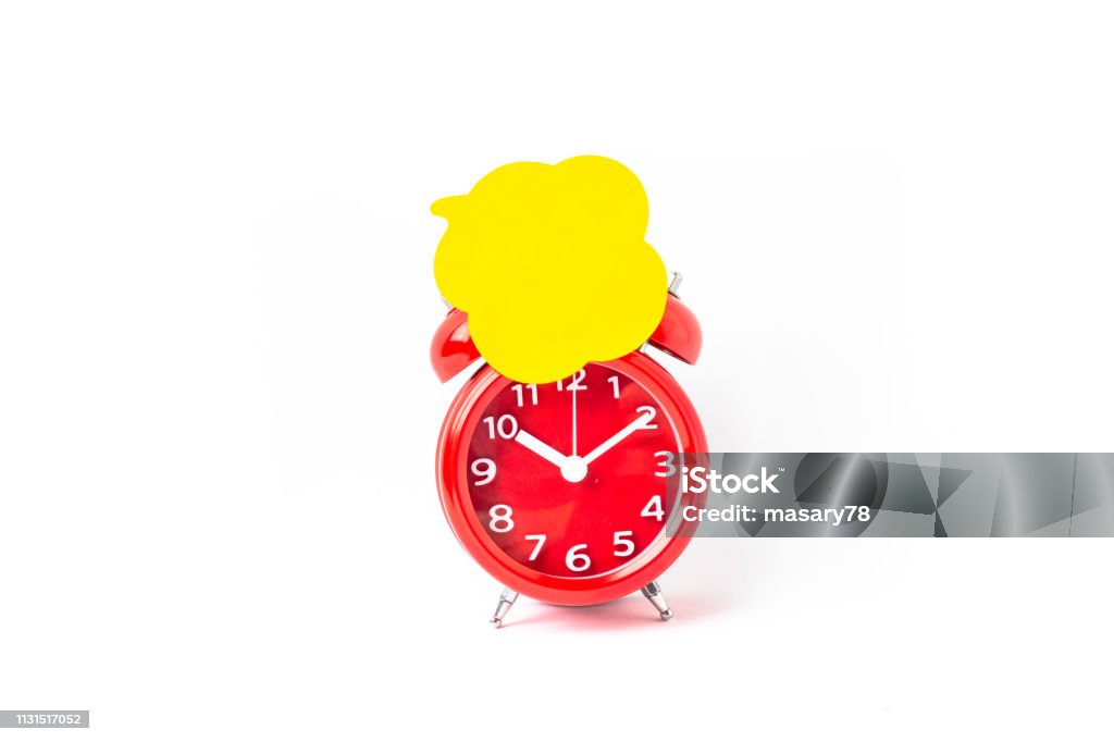 Close up of Speech bubbles On Alarm Clock Close up of Speech bubbles On Alarm Clock with white Background Adhesive Note Stock Photo