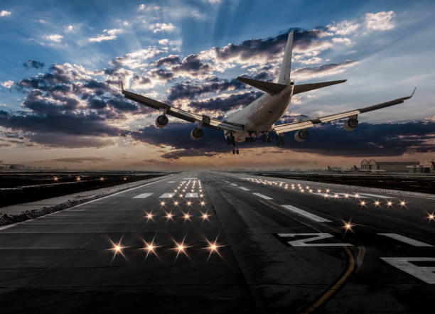 istock Airplane landing at dusk 1131517942