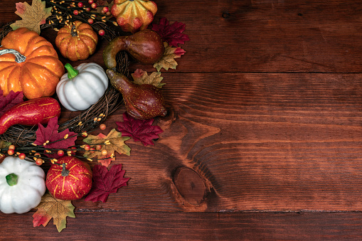 Thanksgiving decor with pumpkins, gourd, squash, maple leaves and berries