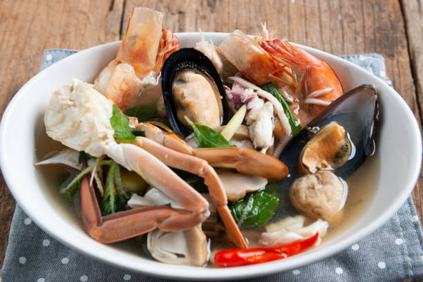 istock Spicy Seafood Soup on white dish , thai cuisine 1131522158