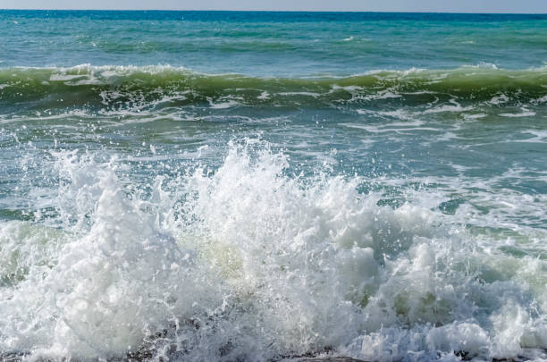 Splashing wave on the Black sea in the day.
