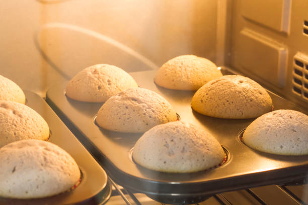 Closeup banana muffin baking in the hot oven