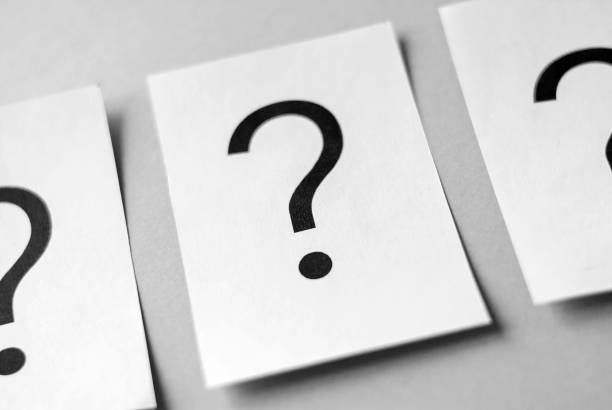 istock Row of black question marks on white cards 1131525720