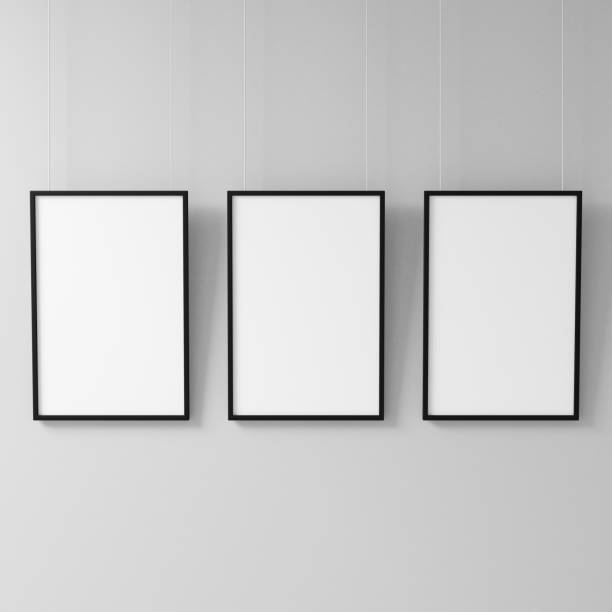 istock Three White posters with black frame Mockup hanging on the wall 1131526103