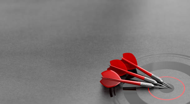 Three darts and business target background and copyspace on the left. Marketing and advertising concept. Three darts and business target over grey background and copyspace on the left. Marketing and advertising concept. 3d illustration position stock pictures, royalty-free photos & images