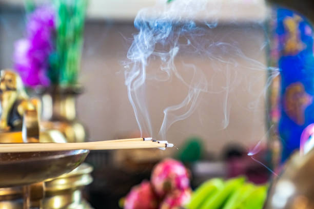 istock Incense on the brass candlestrick with the smoke out from incense. 1131529556